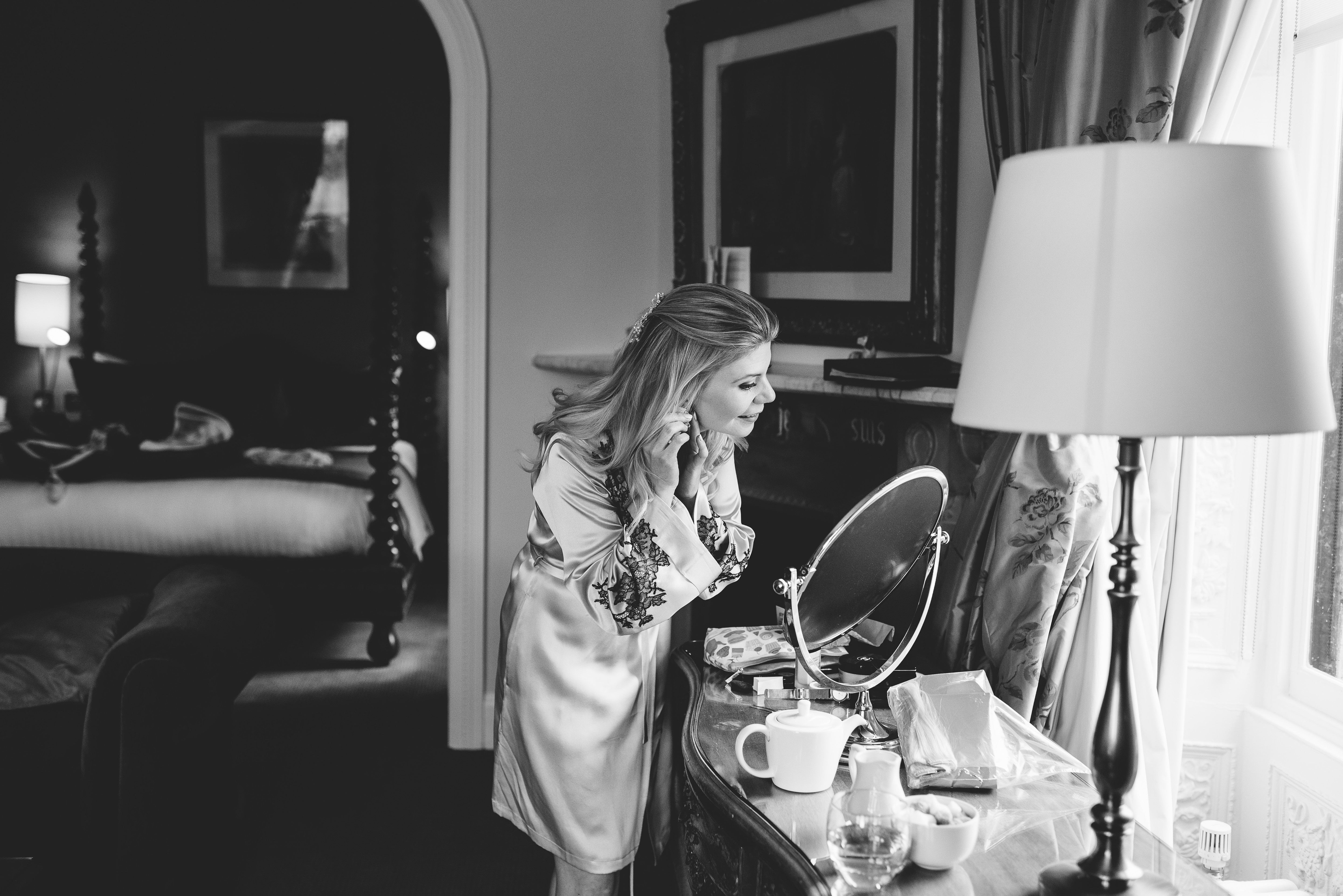 Caroline Randell wearing a Marjolaine silk robe on her wedding morning — getting ready photographs in luxury bridal nightwear